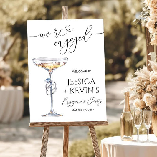 Elegant Ring & Champagne Glass Welcome Sign - "We're Engaged" Calligraphy Decor for Couples