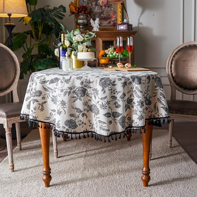 SUTAVIA Boho Cotton Linen Tablecloth Bohemian Black Floral Beige Fabric Tassel Lace Farmhouse Table Top Dust-Proof for Home Kitchen Holiday Party Dining Table (Black Flower, Oval, 60"x84")