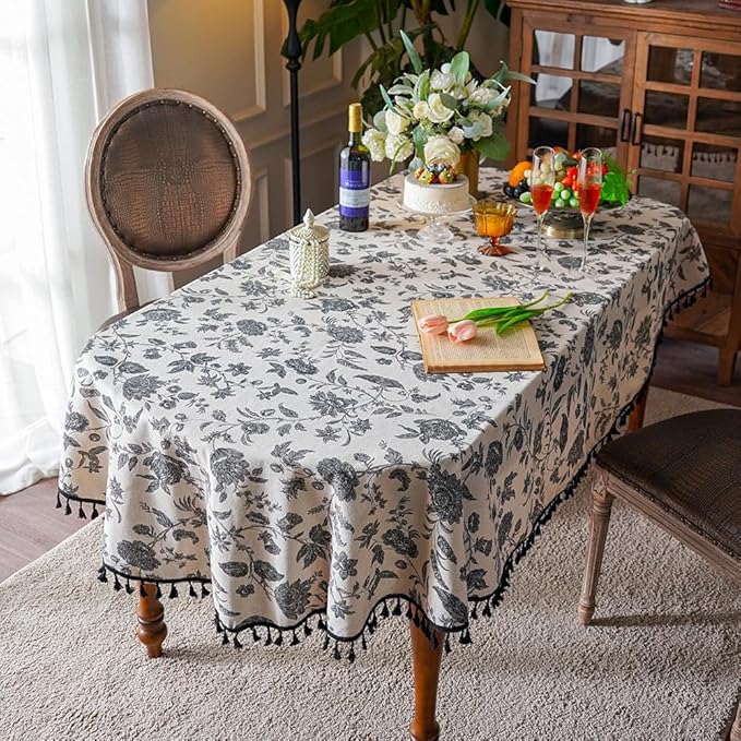 SUTAVIA Boho Cotton Linen Tablecloth Bohemian Black Floral Beige Fabric Tassel Lace Farmhouse Table Top Dust-Proof for Home Kitchen Holiday Party Dining Table (Black Flower, Oval, 60"x84")