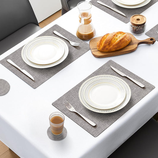 MOSAYT Placemats Set of 4, Heat Resistant Vinyl Place Mats with Coasters, 100% Waterproof Wipeable Washable Faux Leather Table Mats for Kitchen Dining Party Outdoor, 12" x 18", Light Grey