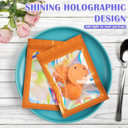 100 Pcs Mylar Bags, Smell Proof Bags Foil Pouch, Holographic Resealable Bags for Small Business, Candy Sample Jewelry Bag Sealable Packaging for Party Favor Food Storage (2.4x3.9in-Orange)