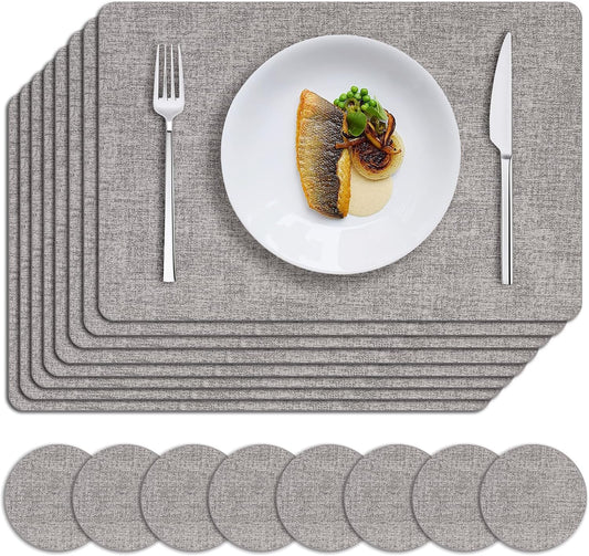 MOSAYT Placemats Set of 8, Heat Resistant Vinyl Place Mats with Coasters, Wipeable Washable 100% Waterproof Oil Proof Faux Leather Table Mats for Kitchen Dining Party Outdoor, 12" x 18", Light Grey